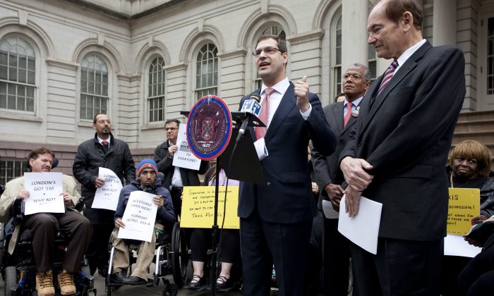 Council member Oliver Koppell (R) is championing a bill to make all taxis wheelchair accessible, but accessibility advocates are unhappy with modifications requiring further study. (Samira Bouaou/The Epoch Times)