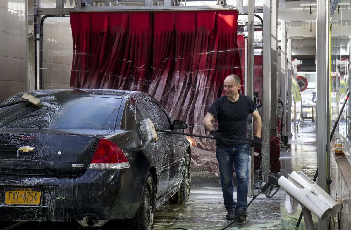 Miguel Portillo, seen washing a car at Jomar Car Wash in Flushing on April 26, 2013. (Samira Bouaou/Epoch Times)
