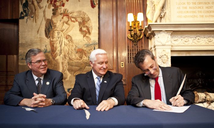 NYPL trustee Ed Wachenheim III (L), Pennsylvania Governor Tom Corbett (C), NYPL president Tony Marx (R), at the 5th avenue New York Public Library on May 22. Corbett and Marx signed an historic agreement that will share an original copy of the Bill of Rights between the Library and the Commonwealth of Pennsylvania. The copy will be available for public view in 2014. (Samira Bouaou/ Epoch Times Staff)