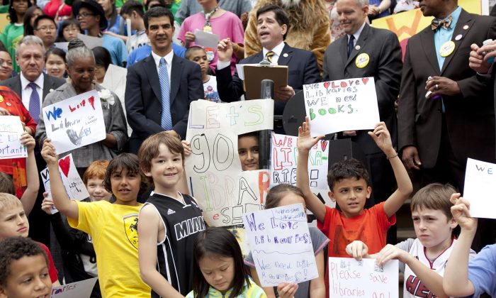 Children during a press conference at City Hall criticizing the budget cuts libraries will be facing on May 22. (Samira Bouaou/The Epoch Times)