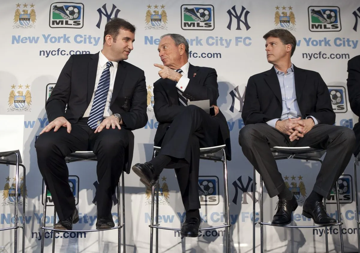 Mayor Michael Bloomberg (C) talks with Manchester City F.C. CEO Ferran Soriano (L), as New York Yankees part-owner Hal Steinbrenner (R) looks on at P.S. 72 in East Harlem on May 22. The New York Yankees partnered with Manchester City F.C. to bring a soccer team to the city, which will be called New York City FC. (Samira Bouaou/The Epoch Times)