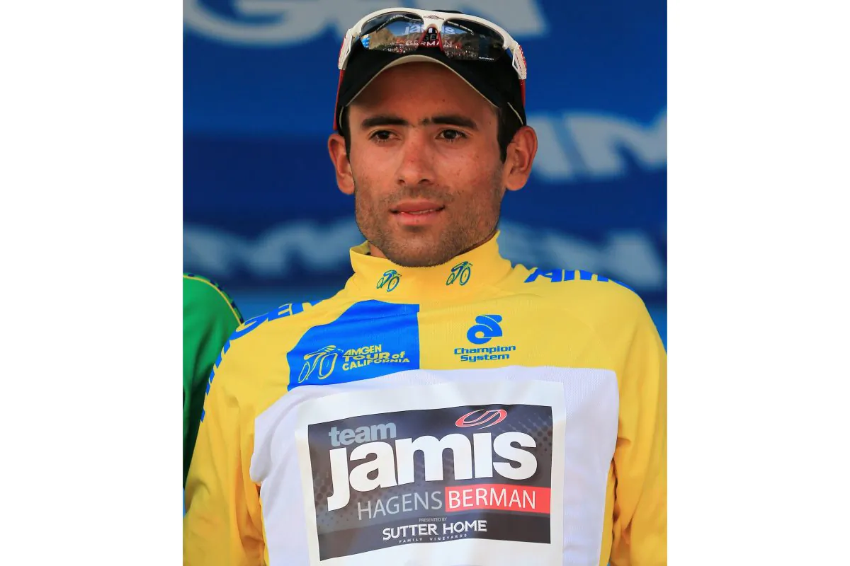 Javier Acevedo of Jamis-Hagens Berman wears the race leader’s yellow jersey on the podium after winning Stage Two of the 2013 Amgen Tour of California from Murrieta to Palm Springs, May 13, 2013. (Doug Pensinger/Getty Images)