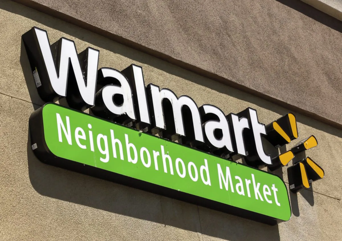 Signage for a newly opened Walmart store is displayed in the Altadena neighborhood of Los Angeles Tuesday, May 28, 2013. (AP Photo/Damian Dovarganes)