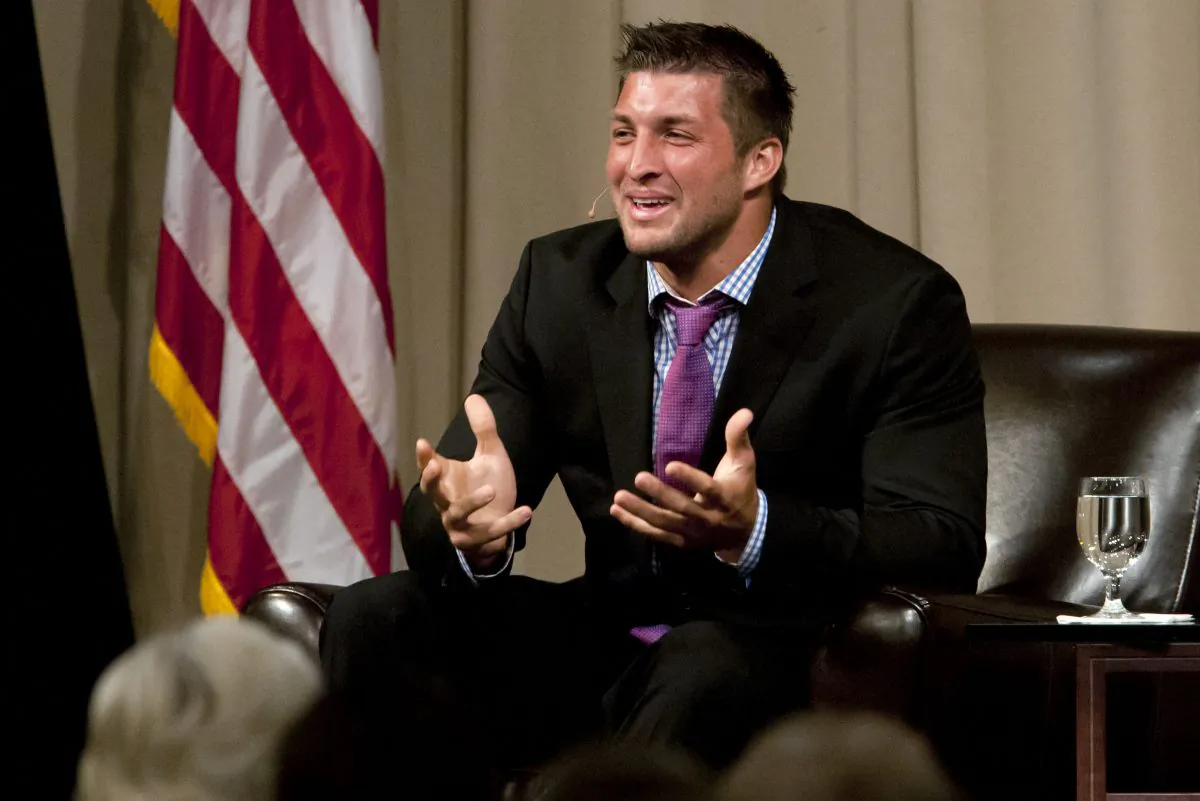 Quarterback Tim Tebow speaks to the Economic Club of Southwest Michigan on Thursday, May 9, 2013. (AP Photo/South Bend Tribune, James Brosher)
