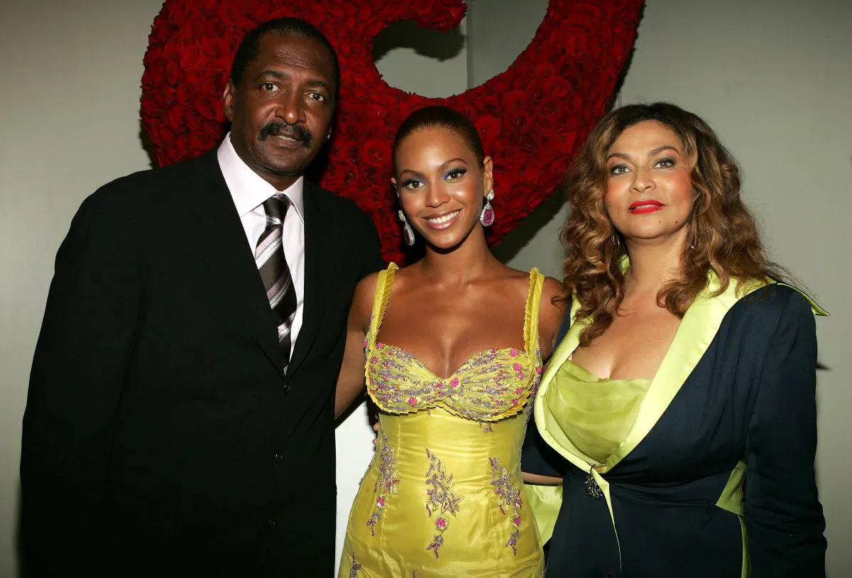 (L-R) Singer Beyonce Knowles (C) poses with her father and manager Matthew Knowles and her mother Tina Knowles at the 'Beyonce: Beyond the Red Carpet auction presented by Beyonce and her mother Tina Knowles along with the House of Dereon to benefit the VH1 Save The Music Foundation June 23, 2005 in New York City. (Frank Micelotta/Getty Images)