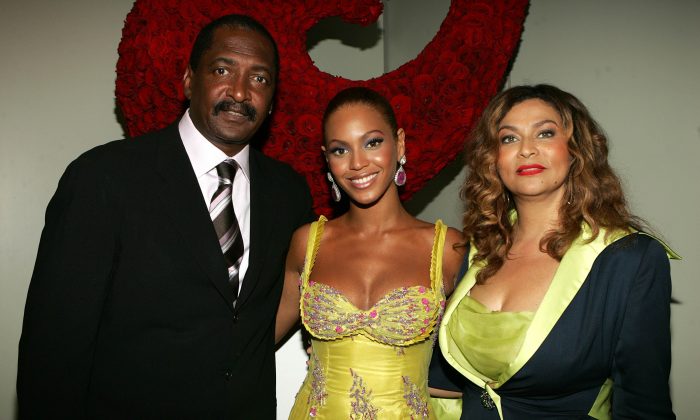 (L-R) Singer Beyonce Knowles (C) poses with her father and manager Matthew Knowles and her mother Tina Knowles at the 'Beyonce: Beyond the Red Carpet auction presented by Beyonce and her mother Tina Knowles along with the House of Dereon to benefit the VH1 Save The Music Foundation June 23, 2005 in New York City. (Frank Micelotta/Getty Images)