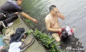 After Rescuing Girl From Polluted River, Chinese Policeman Gets Sick 