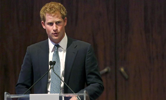Britain's Prince Harry addresses the American Friends of The Royal Foundation dinner in New York, Tuesday, May 14, 2013.  (AP Photo/Brendan McDermid, Pool)