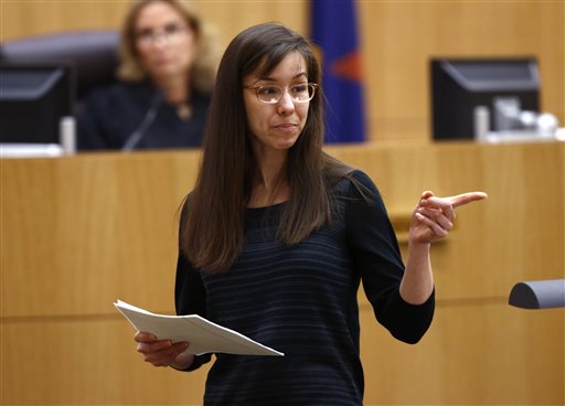 Jodi Arias points to her family as a reason for the jury to give her a life in prison sentence instead of the death penalty on Tuesday, May 21, 2013, during the penalty phase of her murder trial at Maricopa County Superior Court in Phoenix.  Arias was convicted of first-degree murder in the stabbing and shooting to death of Travis Alexander, 30, in his suburban Phoenix. (AP Photo/The Arizona Republic, Rob Schumacher, Pool)