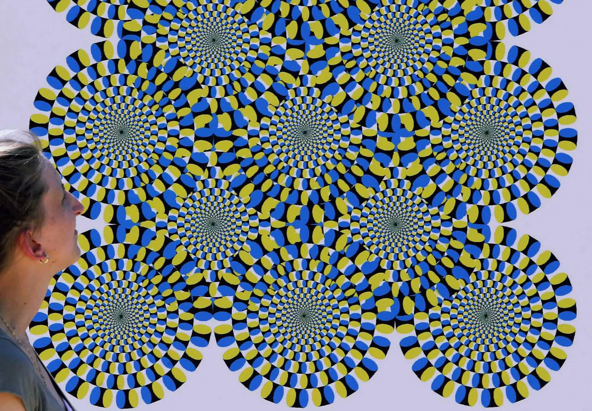 A woman watches an optical illusion eastern Germany in this file photo. Scientists in Hanover, Germany, believe they have discovered a “granulation” in space-time that indicates that our universe is nothing more than a giant hologram. (Michael Urban/AFP/Getty Images)