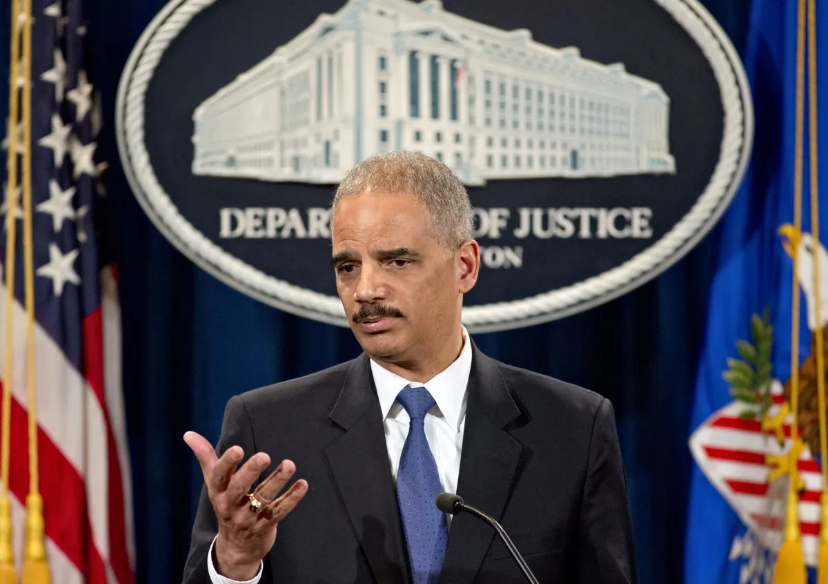 Attorney General Eric Holder is questioned about the Justice Department secretly obtaining two months of telephone records of reporters and editors for The Associated Press, during a news conference at the Justice Department in Washington, Tuesday, May 14, 2013. Holder says he wasn't involved in the probe. (AP Photo/J. Scott Applewhite)