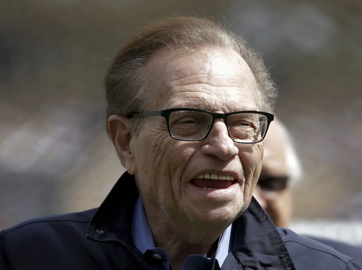 This April 1, 2013, photo shows talk show host Larry King attending a season-opening baseball game between the Los Angeles Dodgers and the San Francisco Giants in Los Angeles. King will host a political talk show beginning next month. The new program, "Politics with Larry King," will air on the RT America network, a global, English-language channel based in Russia, the network announced Wednesday, May 29, 2013. (AP Photo/Jae C. Hong)