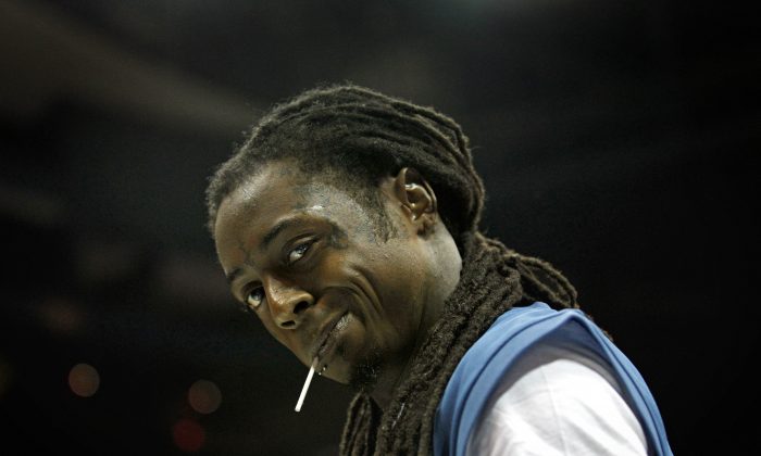 This Oct. 7, 2011 file photo shows Hip Hop artist  Lil Wayne. (AP Photo/David Goldman, file)