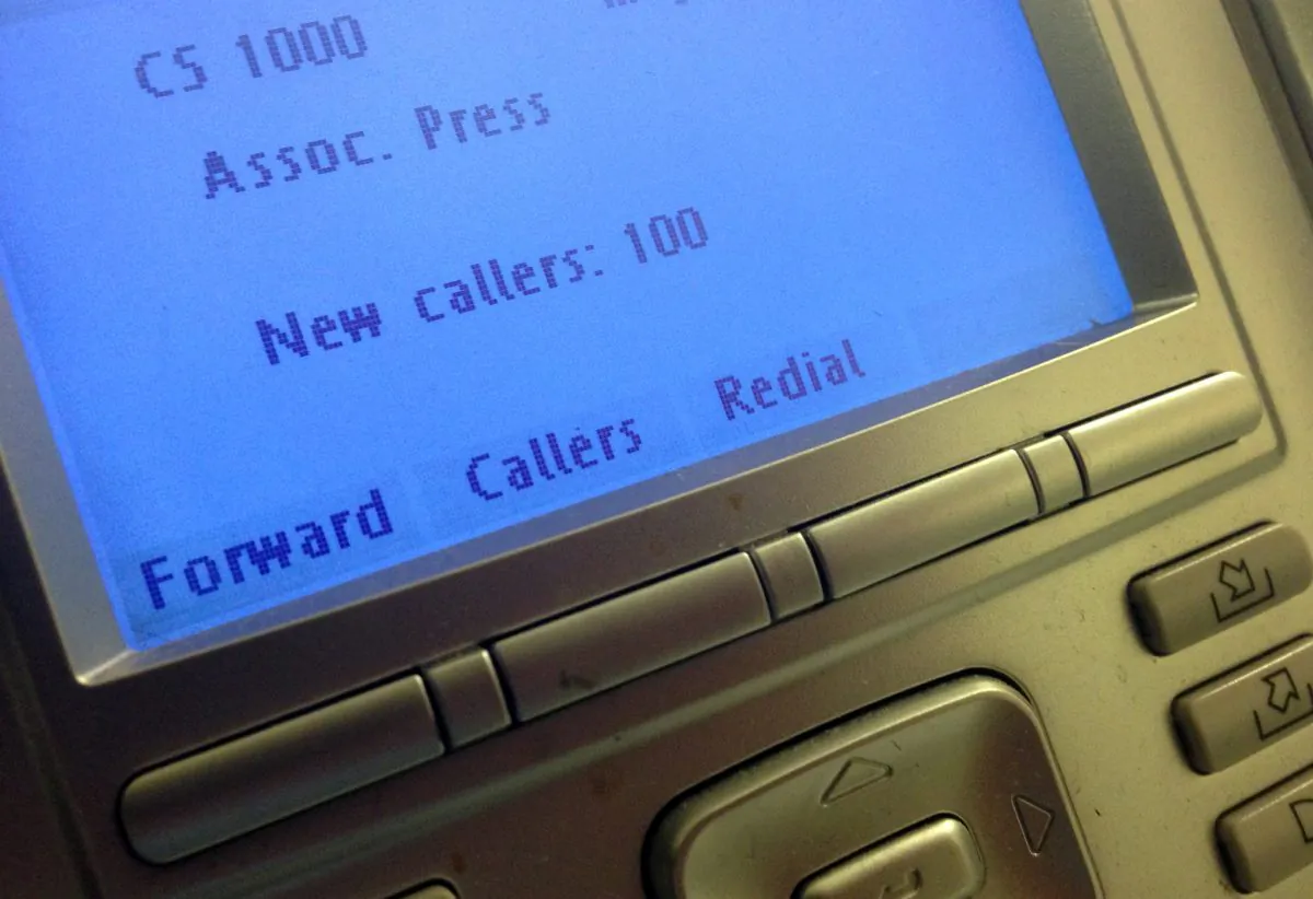 The screen on the phone console at the reception desk at The Associated Press Washington bureau, Monday, May 13, 2013. The Justice Department secretly obtained two months of telephone records of reporters and editors for The Associated Press in what the news cooperative's top executive called a "massive and unprecedented intrusion" into how news organizations gather the news.  (AP Photo/Jon Elswick)