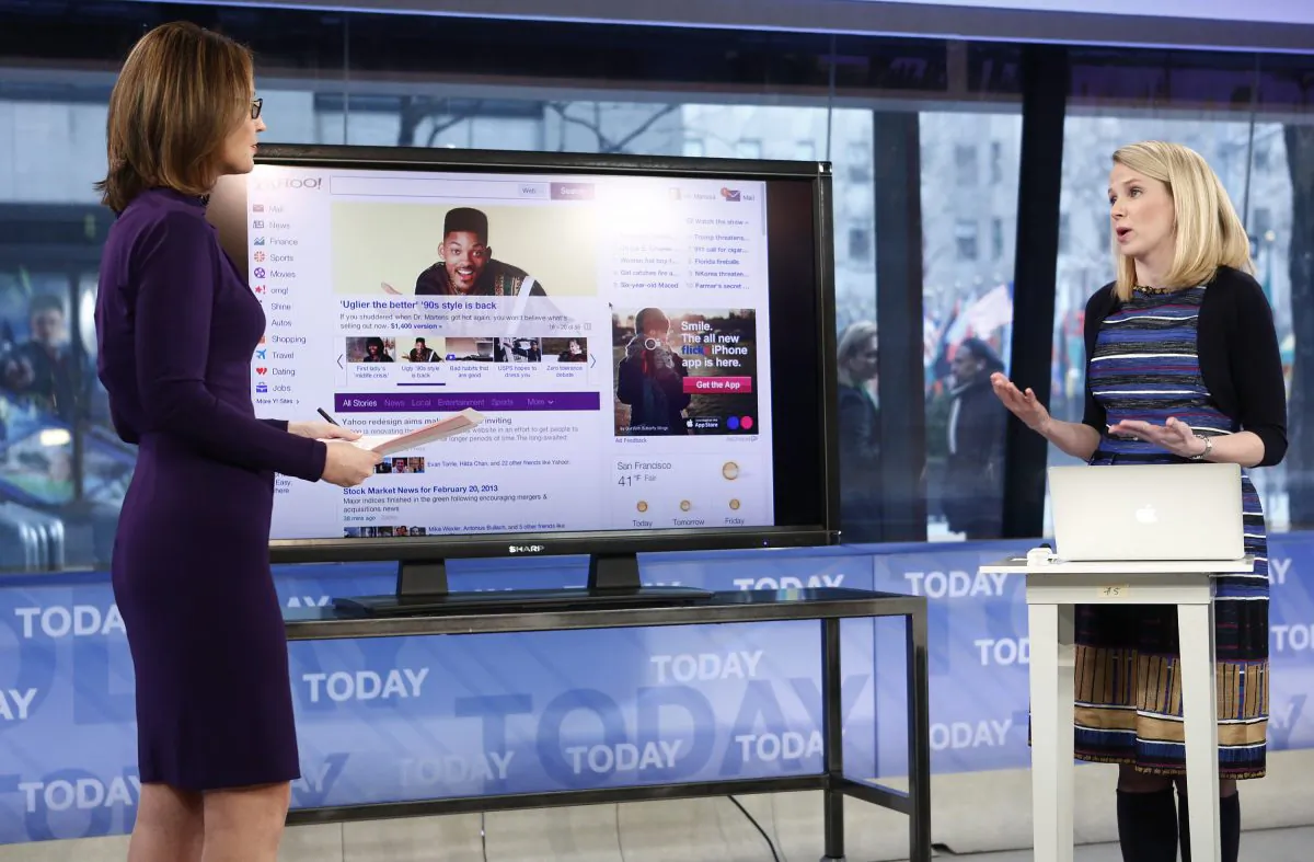 This image released by NBC shows host Savannah Guthrie, left, with Yahoo CEO Marissa Mayer on NBC News' "Today" show, Wednesday, Feb. 20, 2013 in New York as Mayer introduces the website's redesign. (AP Photo/NBC Peter Kramer/NBC/NBC NewsWire)