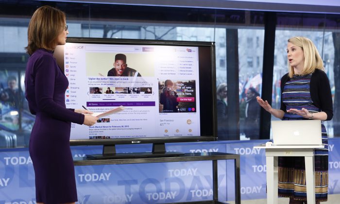 This image released by NBC shows host Savannah Guthrie, left, with Yahoo CEO Marissa Mayer on NBC News' "Today" show, Wednesday, Feb. 20, 2013 in New York as Mayer introduces the website's redesign. (AP Photo/NBC Peter Kramer/NBC/NBC NewsWire)