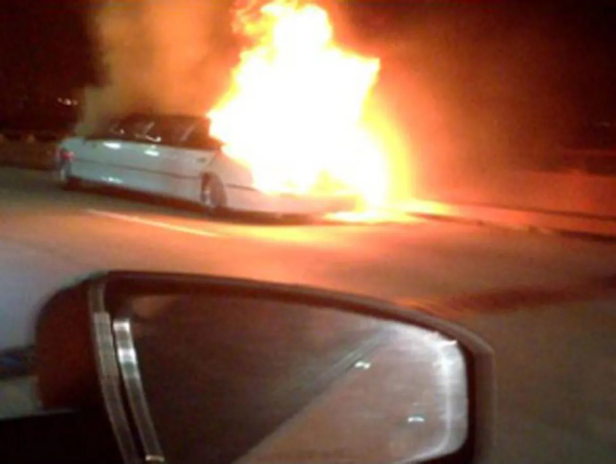 This frame grab taken from video provided by Roxana and Carlos Guzman shows a Limo on fire Saturday, May 4, 2013. (AP Photo/Roxana and Carlos Guzman)