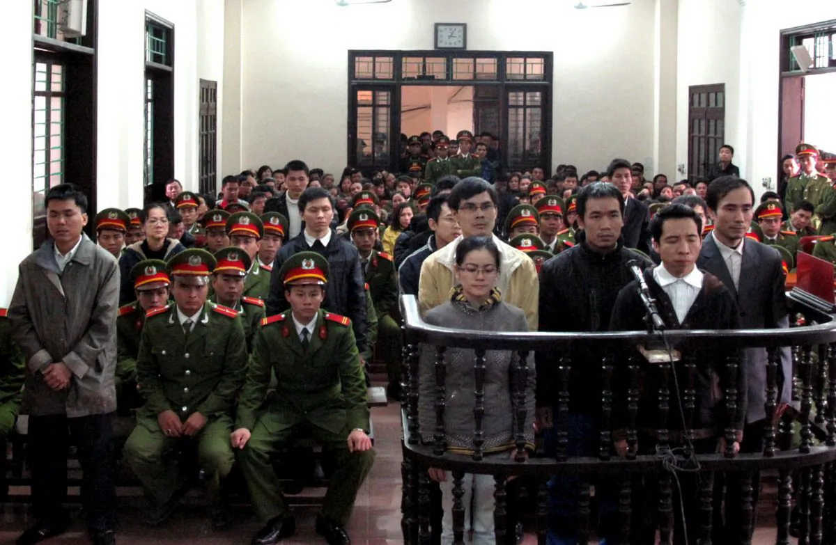 A group of activists accused of plotting to overthrow the communist regime listen to verdicts at a court in the northern Vietnamese city of Vinh. One of the activists, blogger Dang Xuan Dieu, accused Vietnamese authorities of "trampling on the eternal good morals of the Vietnamese nation." (Vietnam News Agency/AFP/Getty Images)