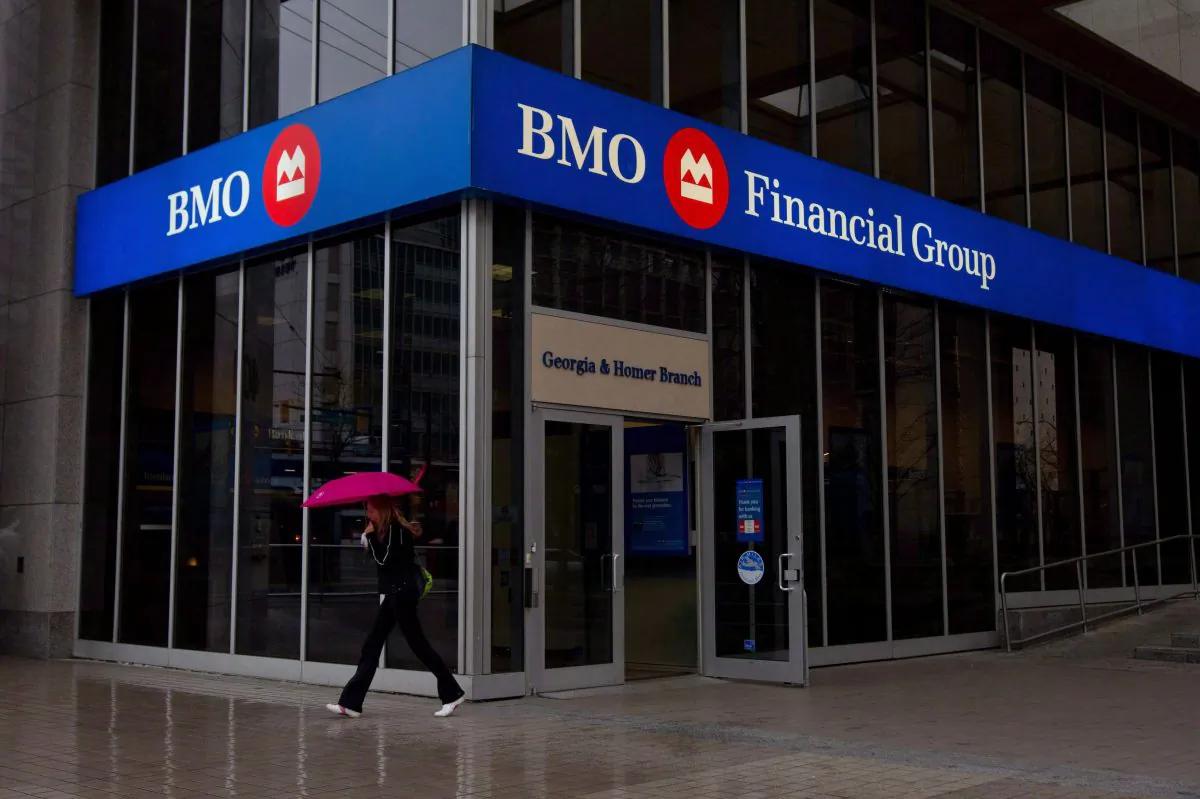 A woman leaves a Bank of Montreal branch in downtown Vancouver, B.C., on March 22, 2011. BMO Financial Group has added its voice to a chorus of Canadian banks that say they must control expenses during the current period of sluggish consumer lending. (THE CANADIAN PRESS/Darryl Dyck)
