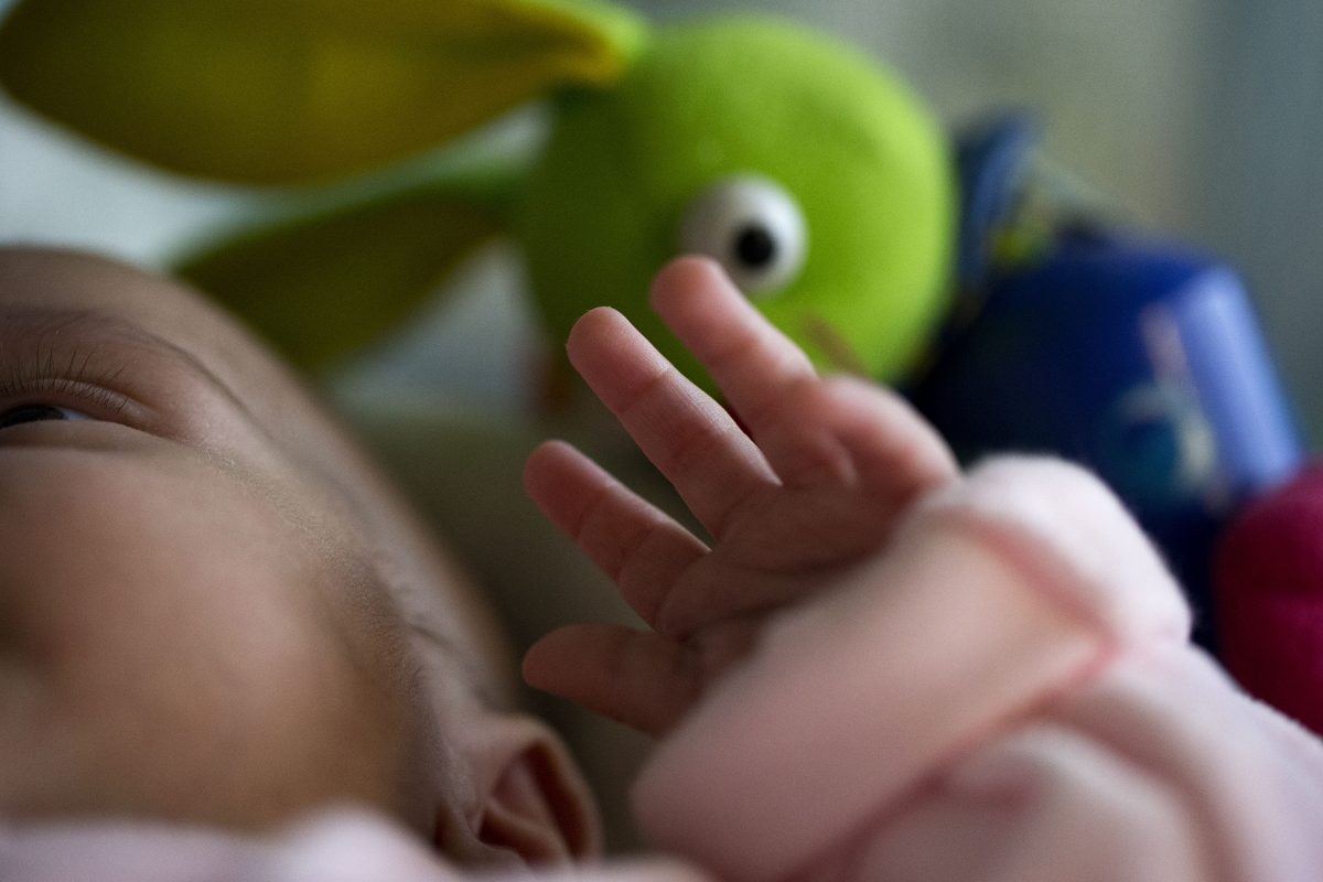 A file photo of a newborn on a cot in the neo-natal ward of the Delafontaine hospital in Saint Denis near Paris on March 19, 2013. Some governments hold that babies should not be given names that could cause them suffering in life, and ban parents from using unusual names. (Joel Saget/AFP/Getty Images)