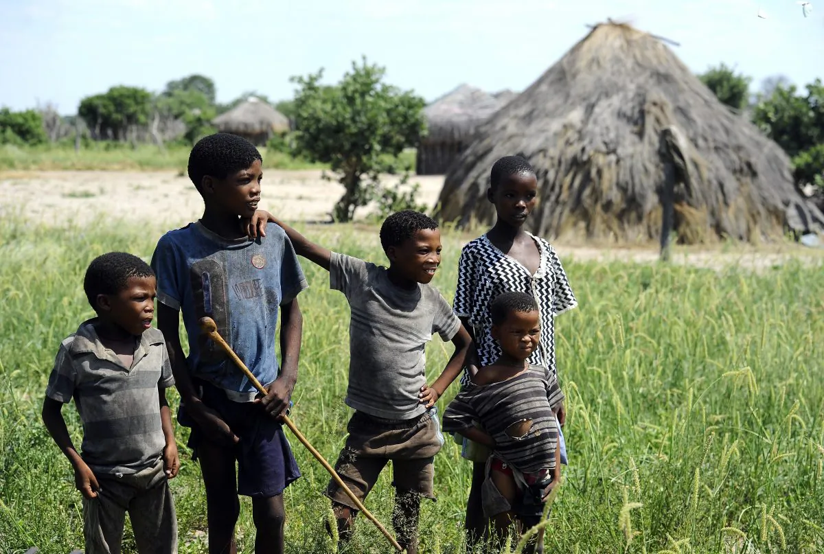 A file photo of young Kalahari Bushmen posing for a photograph outside a traditional hut in Molapo, in the center of the Kalahari Game Reserve in Botswana on Feb. 18, 2012. The Bushmen won a long battle with the Botswana government to secure new wells. Though personal freedoms of Botswana citizens are still limited in some ways, the nation is highly tolerant compared to other African nations and many other nations in the world. (Stephane de Sakutin/AFP/Getty Images)
