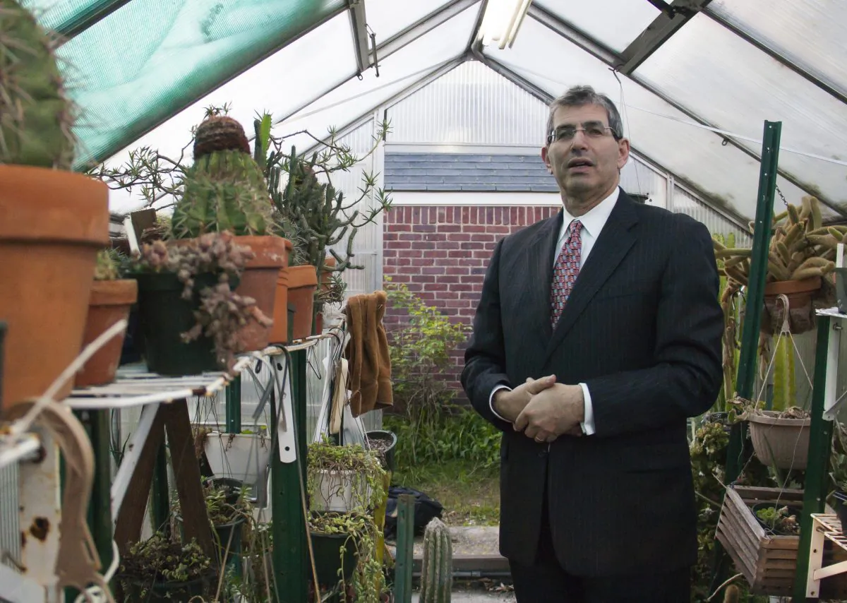 Norman Bobrow, president of Norman Bobrow and Company, stands amid cacti in one of his two greenhouses. Bobrow owns more than 2,000 cacti from different parts of the world. (Ivan Pentchoukov/Epoch Times)