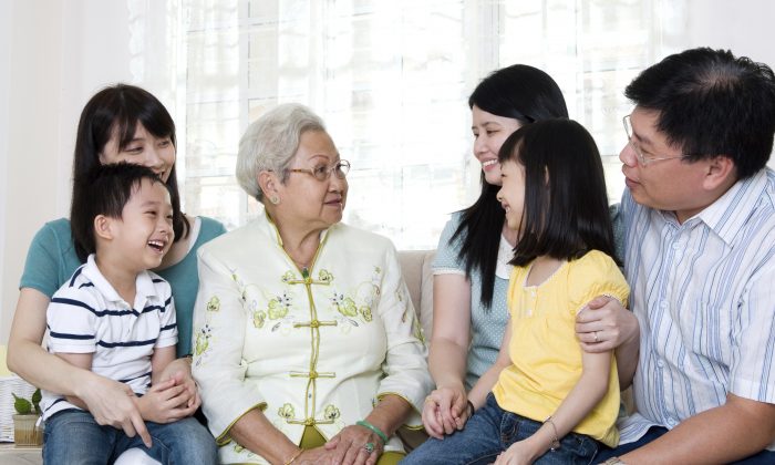 A grandmother is surrounded by her devoted family. Traditional Chinese culture regards filial piety as the root of all virtue and teaches that observance of filial piety begins with one’s parents, extends to the service of the ruler, and brings about peace and harmony in the world. (Wong Sze Yuen/Photos.com)
