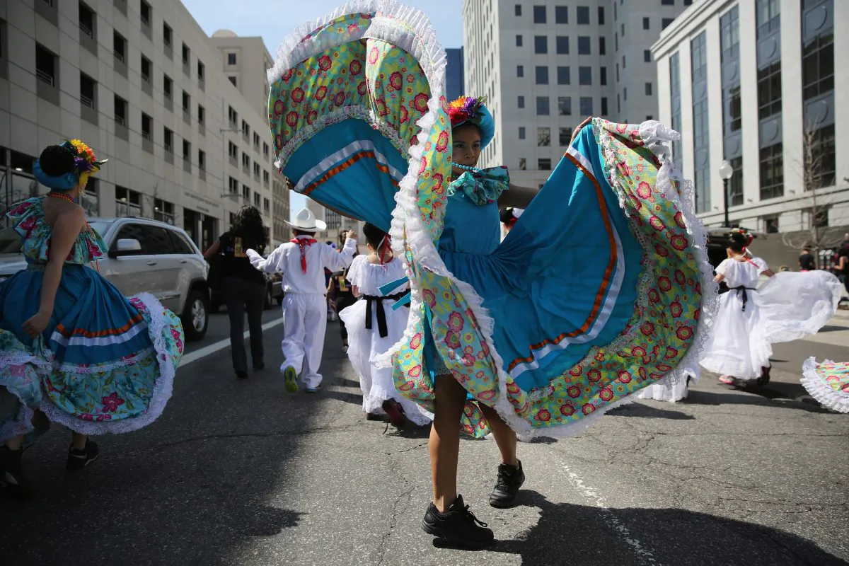 Children dressed in traditional Mexican attire dance during a parade at the Cinco de Mayo celebration in Denver, Col. on May 4, 2013. Hundreds of thousands of people were expected to attend the two day event, billed as the largest Cinco de Mayo celebration in the United States. (John Moore/Getty Images)