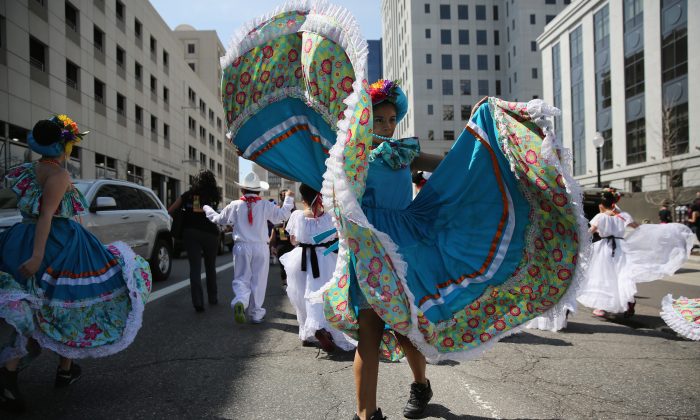 Children dressed in traditional Mexican attire dance during a parade at the Cinco de Mayo celebration in Denver, Col. on May 4, 2013. Hundreds of thousands of people were expected to attend the two day event, billed as the largest Cinco de Mayo celebration in the United States. (John Moore/Getty Images)