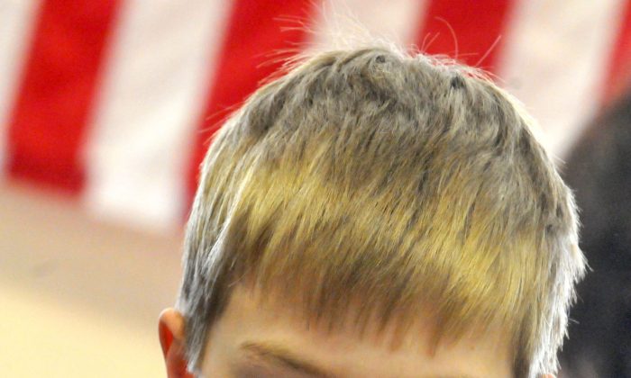 A photo of fifth-grader Daniel Slotten reading for comprehension during an exam that reflects new literacy standards for the Common Core initiative at a Westview Elementary School class in Apple Valley, Minn. on Feb. 20, 2013. (AP Photo/The St. Paul Pioneer Press, John Doman)