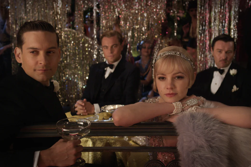 (L-R) Nick Carraway played by Tobey Maguire, Jay Gatsby (Leonardo DiCaprio), Daisy Buchanan (Cary Mulligan) and Tom Buchanan (Joel Edgerton) the romantic drama “The Great Gatsby.” (Warner Bros. Pictures)