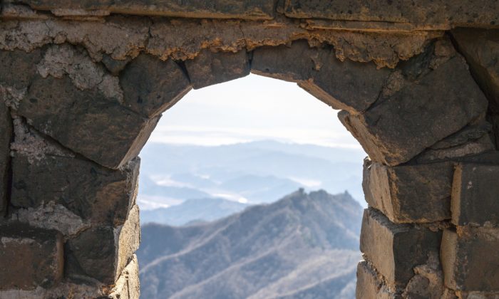 Looking through a window of a watchtower on the Great Wall of China. As soon as soldiers of great courage receive urgent news of an enemy attack, they immediately rush to defend their country, determined to fulfill their duty without hesitation. (Mirko Kirstein/Photos.com)