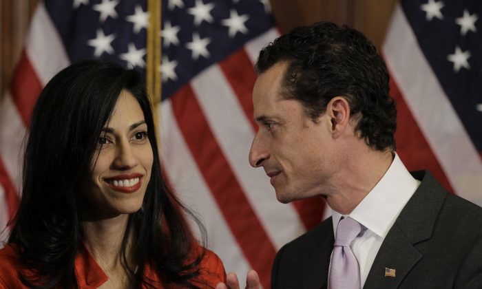 Rep. Anthony Weiner, (D-N.Y.), and his wife, Huma Abedin, aide to Secretary of State Hillary Rodham Clinton, are pictured after a ceremonial swearing in of the 112th Congress on Capitol Hill in Washington, Wednesday, Jan. 5, 2011. (AP Photo/Charles Dharapak)