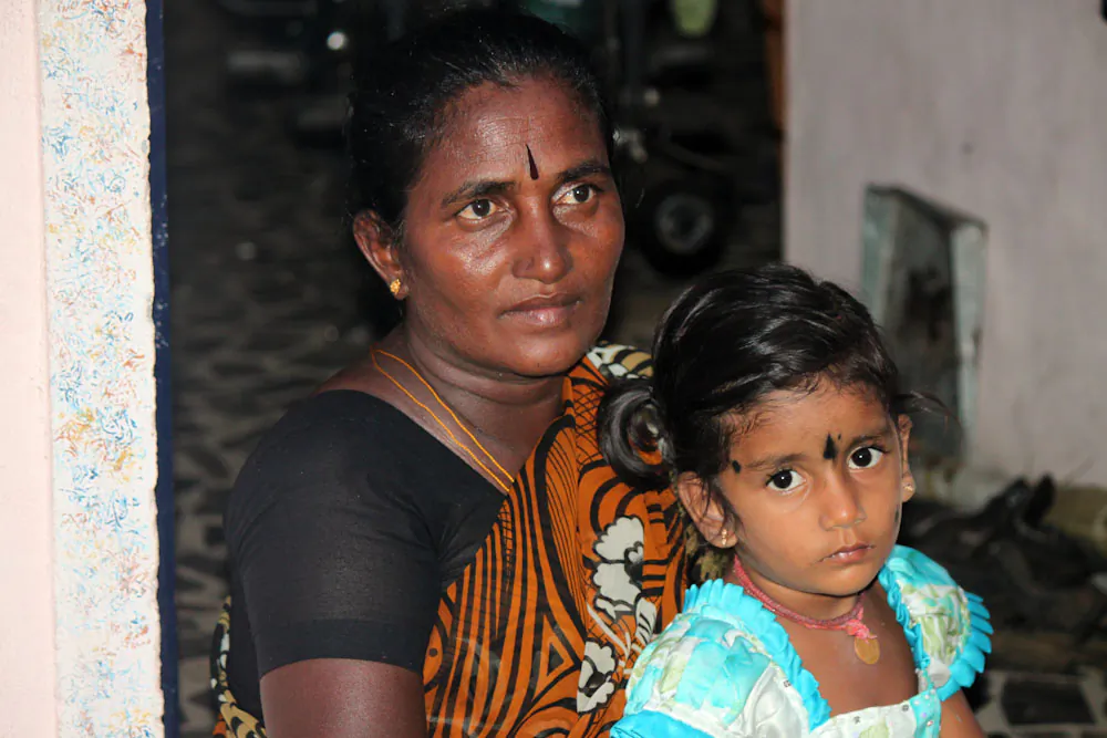 Kalamani with her niece at the entrance to her home in Kondamathanoor village, Tamil Nadu, India, on May 29. Kalamani took an unprecedented step in entering local elections as a lower caste woman. (Venus Upadhayaya/Epoch Times)
