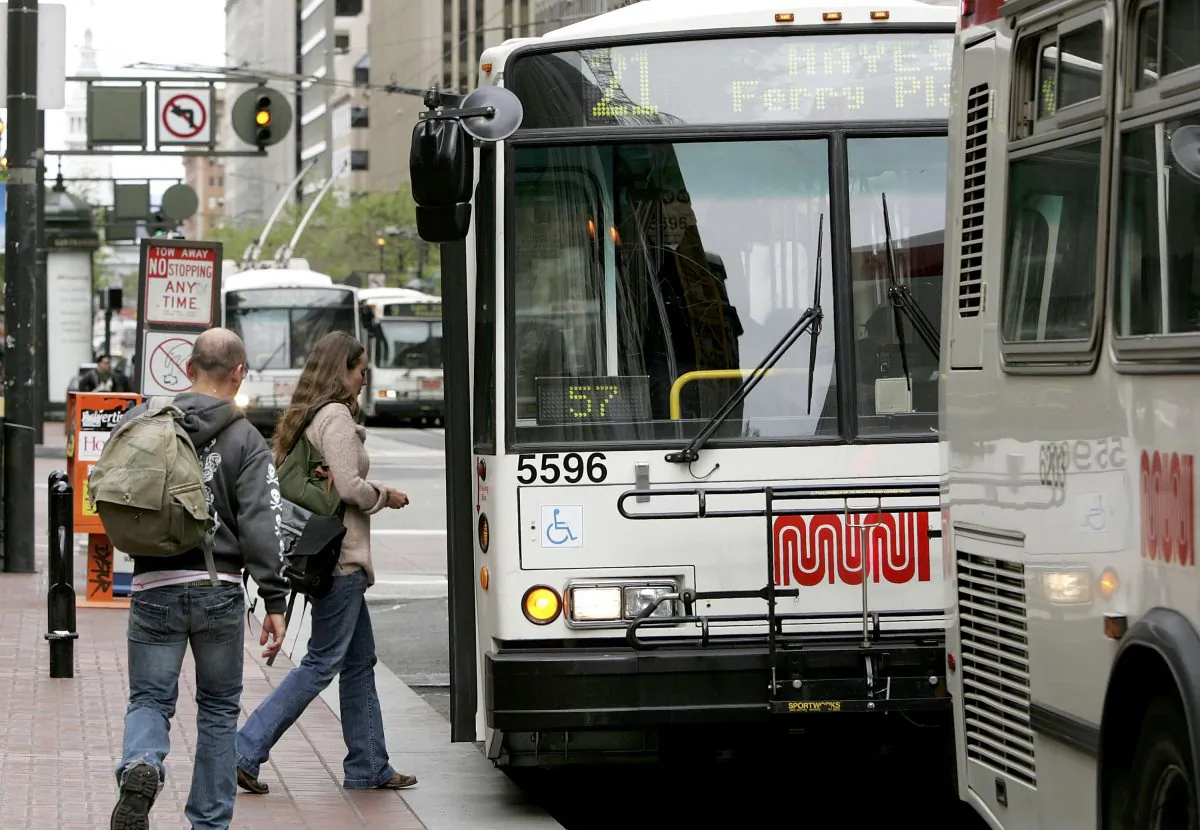 Passengers board a Muni bus along Market Street in San Francisco, Calif., on April 25, 2006. Muni and public transportation are the most commented-on issues for San Francisco residents in a recent survey. (Justin Sullivan/Getty Images)