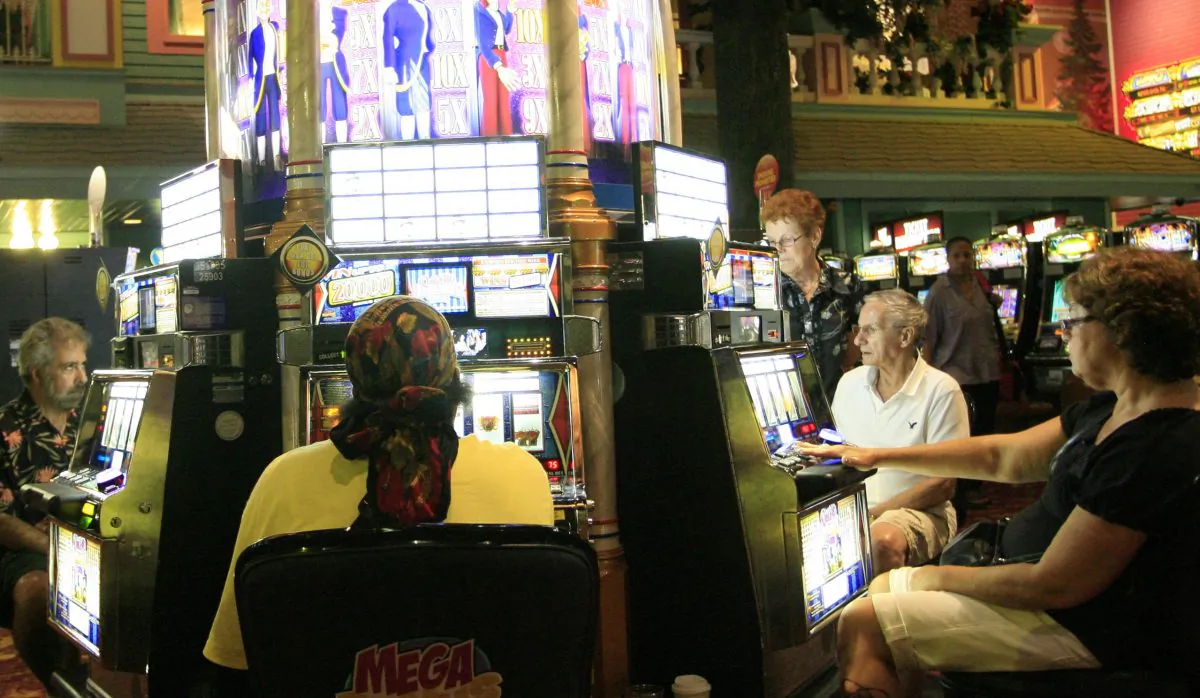 A file photo of people playing slot machines at a casino in Atlantic City, New Jersey, on Aug. 17, 2010. Overall, New Jersey's 12 casinos reported a decline in gross profits for April 2013 over April 2012 figures, with the new Revel casino reporting a 40 percent decline. (Abdullah Pope/AFP/Getty Images)
