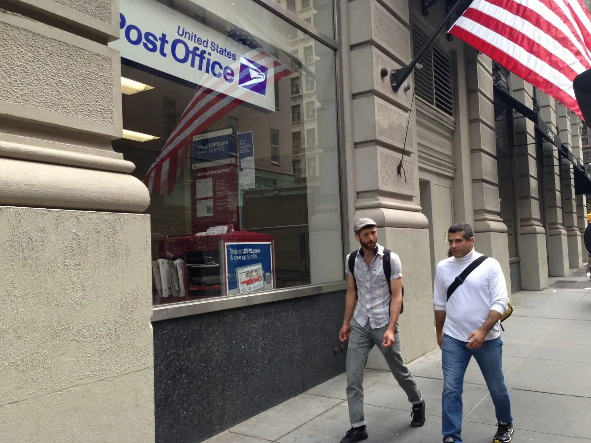  People walk by the newly-opened post office near the Madison Square Park. (Ivan Pentchoukov/The Epoch Times) 