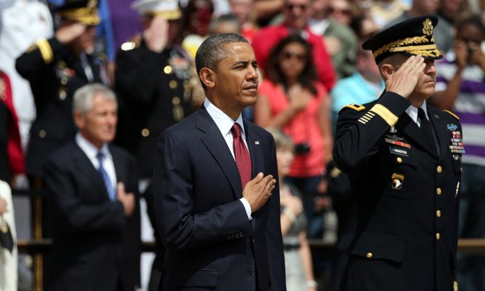 U.S. President Barack Obama and Major Gen. Michael S. Linnington stand before a wreath ceremony on Memorial Day at the Tomb of the Unknowns at Arlington National Cemetery on May 27, 2013. (Mark Wilson/Getty Images)