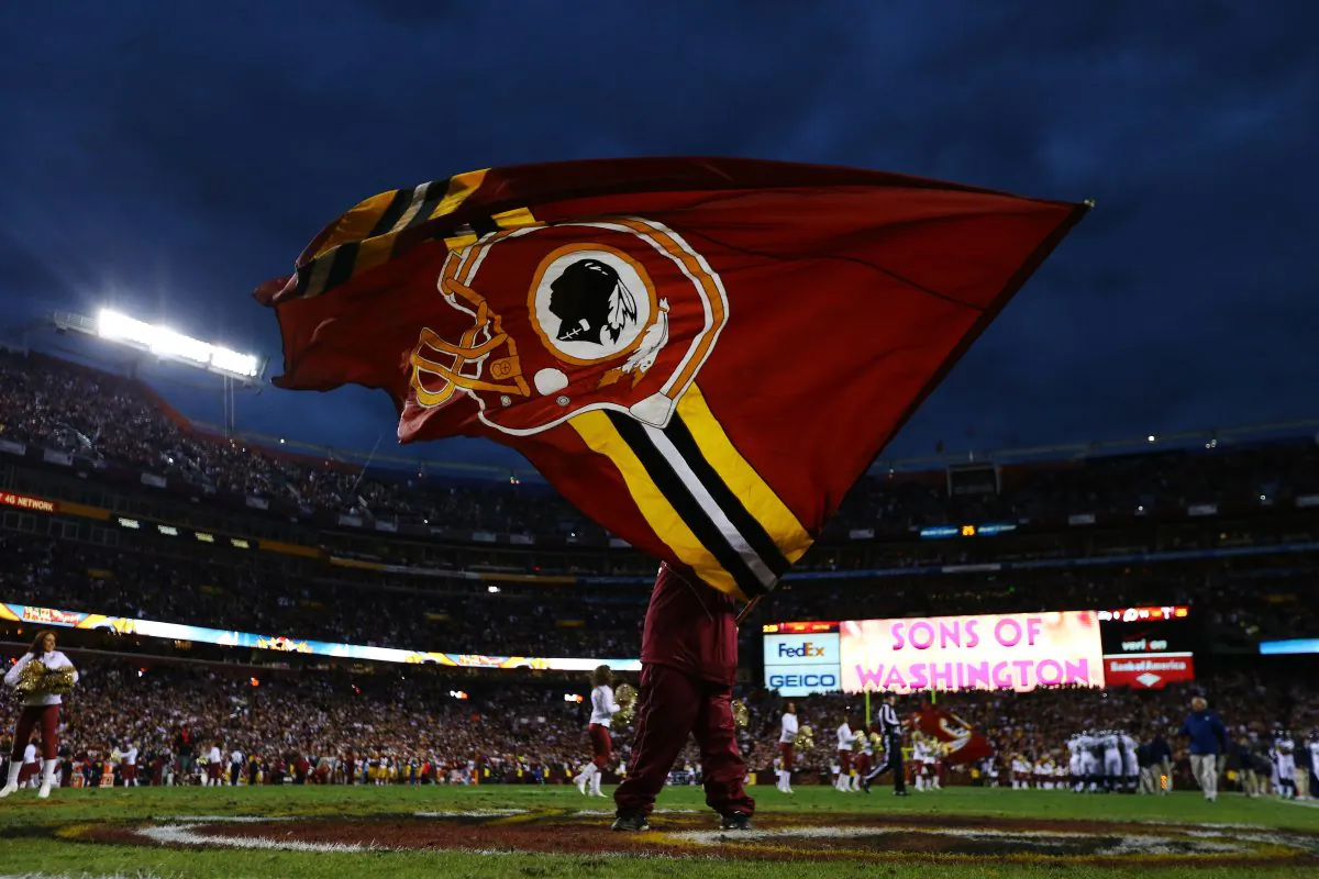 A Washington Redskins flag is waved prior to the NFC Wild Card Playoff Game against the Seattle Seahawks at FedExField in Landover, Md., on January 6, 2013. (Al Bello/Getty Images)