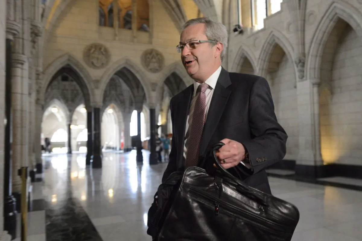 Chief electoral officer Marc Mayrand arrives at the Commons house affairs committee in Ottawa on Tuesday May 28, 2013. Mayrand confirmed for the first time that Conservative party workers have failed to co-operate with an investigation into fraudulent robocalls. (THE CANADIAN PRESS/Adrian Wyld)