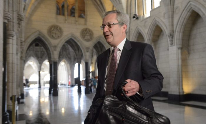 Chief electoral officer Marc Mayrand arrives at the Commons house affairs committee in Ottawa on Tuesday May 28, 2013. Mayrand confirmed for the first time that Conservative party workers have failed to co-operate with an investigation into fraudulent robocalls. (THE CANADIAN PRESS/Adrian Wyld)
