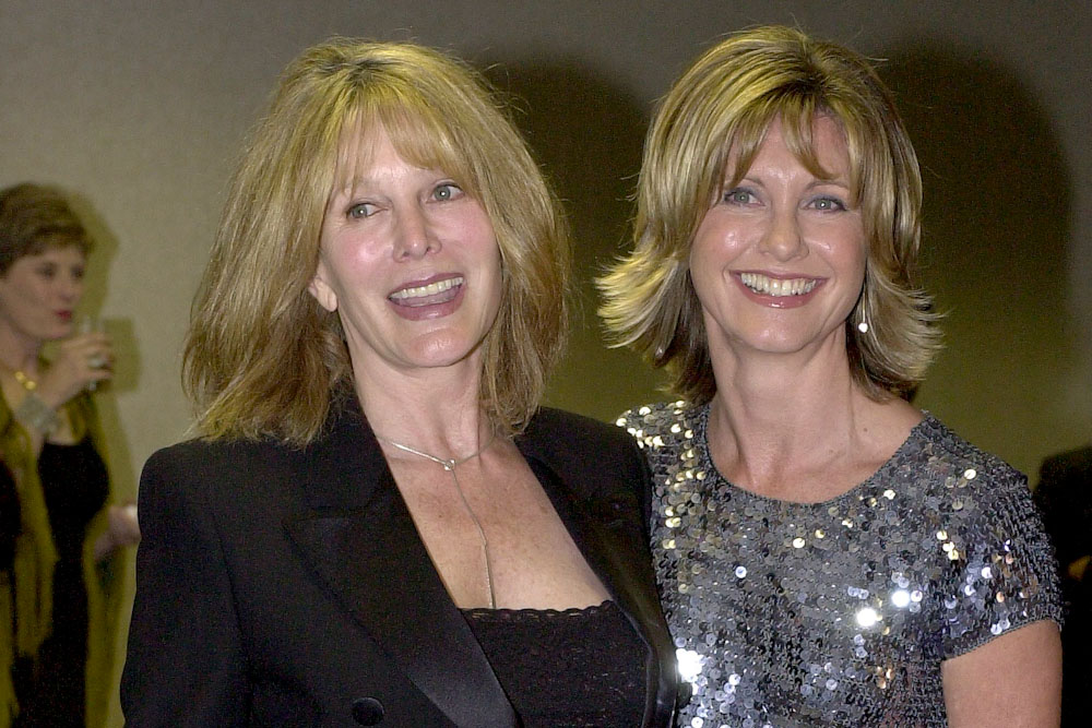 Actress Olivia Newton-John, right, poses with her sister, Rona Newton-John, at a cocktail reception before the 10th Annual Human Rights Campaign Gala in Los Angeles, Calif., on Feb. 17, 2001.  (Photo by Newsmakers) 