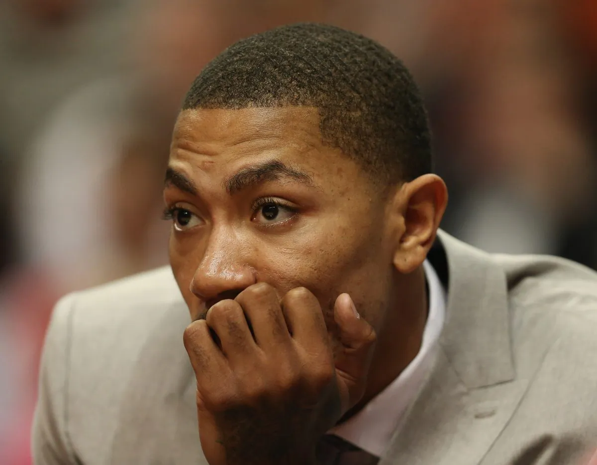 Derrick Rose of the Chicago Bulls watches from the bench as his teammates take on the Miami Heat in Game Three of the Eastern Conference Semifinals during the 2013 NBA Playoffs at the United Center on May 10, 2013 in Chicago, Illinois. (Jonathan Daniel/Getty Images)