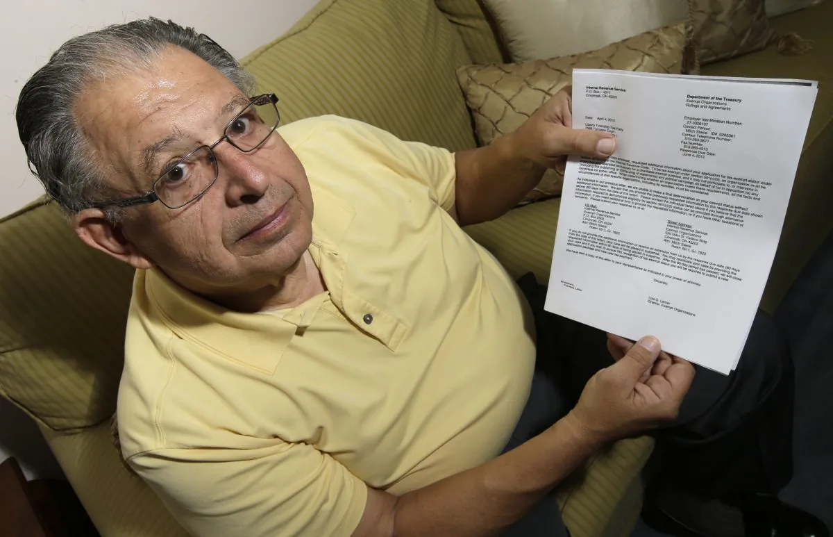 Tim Savaglio, a member of the Liberty Township Tea Party, displays one of the letters his group received from the IRS at his home in West Chester, Ohio, May 15. (AP Photo/Al Behrman)