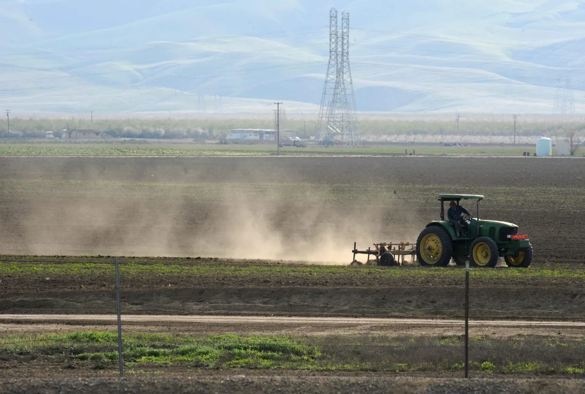 Dust rises as a farmer plows a field in Mendota, Calif., in the state's San Joaquin Valley on March 11, 2009. Dust carries spores that cause valley fever, a growing problem in the southwestern states. (Robyn Beck/AFP/Getty Images)