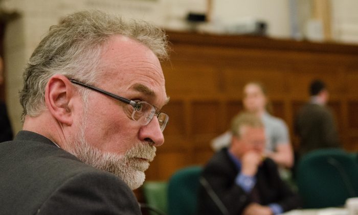 Canada's Auditor General Michael Ferguson waits to testify at a House of Commons committee April 17, 2013. Ferguson's spring report points to over $3billion dollars in funding for anti-terrorism efforts that can't be properly tracked. (Matthew Little/The Epoch Times)