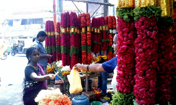 A flower Vendor, Varalakshmi, sells flowers in Ulsoor locality of Bangalore city, India. She has been selling flowers for the past 25 years. (Tarun Bhalla)