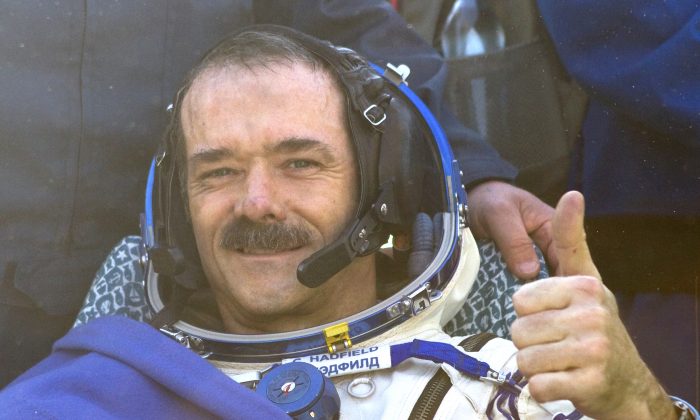 Canadian spaceman Chris Hadfield gives a thumbs up shortly after his landing aboard the Russian Soyuz space capsule in central Kazakhstan on May 13, 2013. Hadfield became an international celebrity with his tweets from space and cover of David Bowie's "Space Oddity."
(Sergei Remezov/AFP/Getty Images)