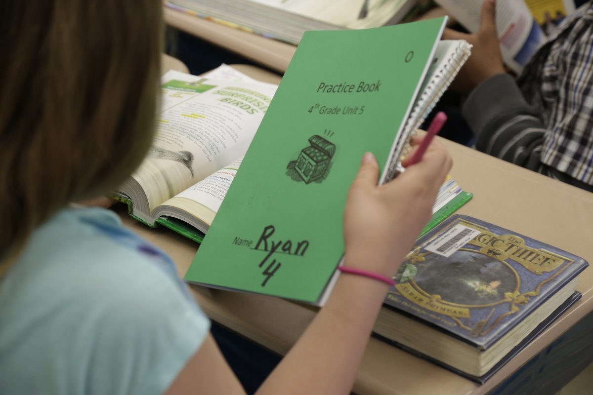 ADVANCE FOR USE TUESDAY, MAY 28, 2013 AND THEREAFTER - Ryan, a "gender variant" fourth grader, sits at her desk in her school in Illinois on May 2, 2013. Ryan outwardly lives life as a girl but is physically still a boy underneath. "I feel that I'm a girl in my heart and a boy in my brain," the 10-year-old says. (AP Photo/M. Spencer Green)