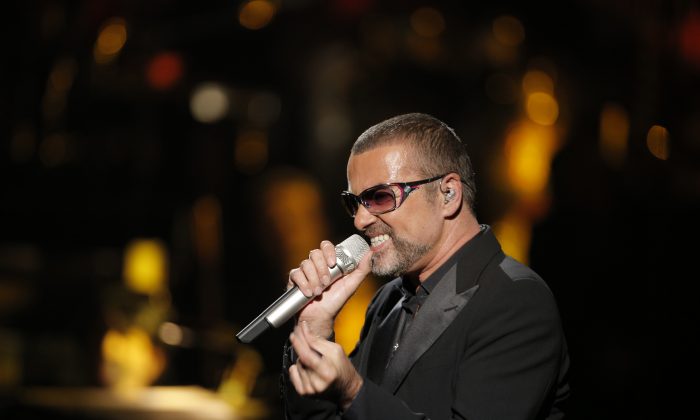 In this Sept. 9, 2012 file photo, British singer George Michael performs at a concert to raise money for AIDS charity Sidaction, during the Symphonica tour at Palais Garnier Opera house in Paris, France. (AP Photo/Francois Mori, File)